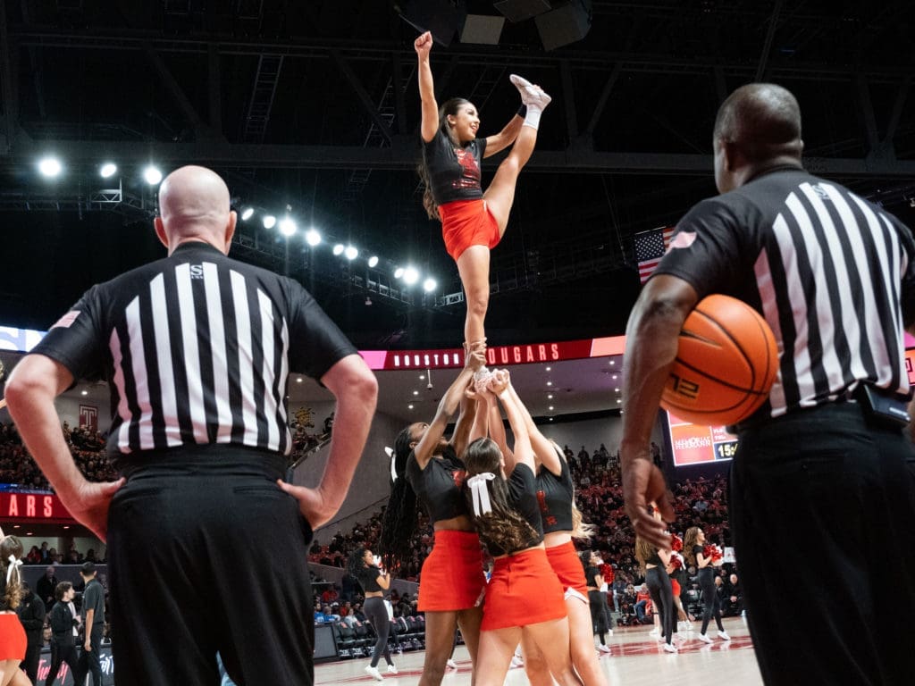 University of Houston cheerleaders add to the Fertitta Center atmosphere. (Photo by F. Carter Smith)
