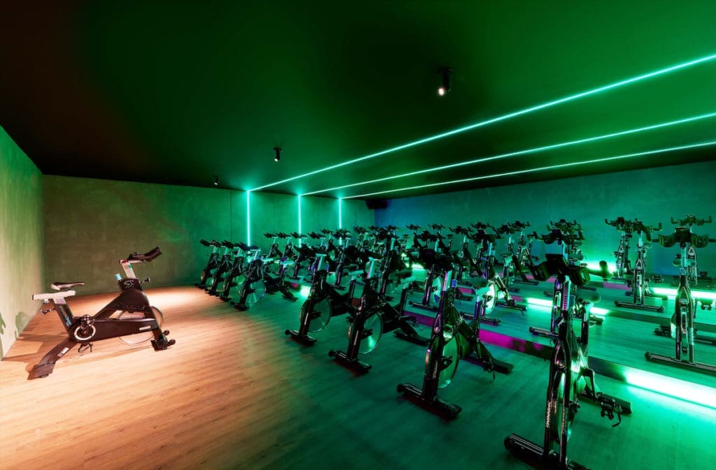 Cycling is one of many boutique style classes at John Reed, which also offers mat Pilates, yoga, HIIT, dance cardio, and more.  (Photo by JOHN REED Fitness)