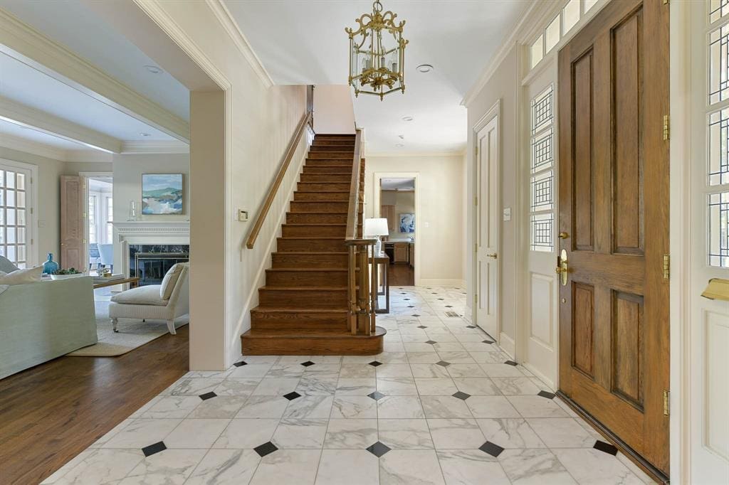 An elegant entryway sets the tone for this Richard Drummond Davis-designed home.