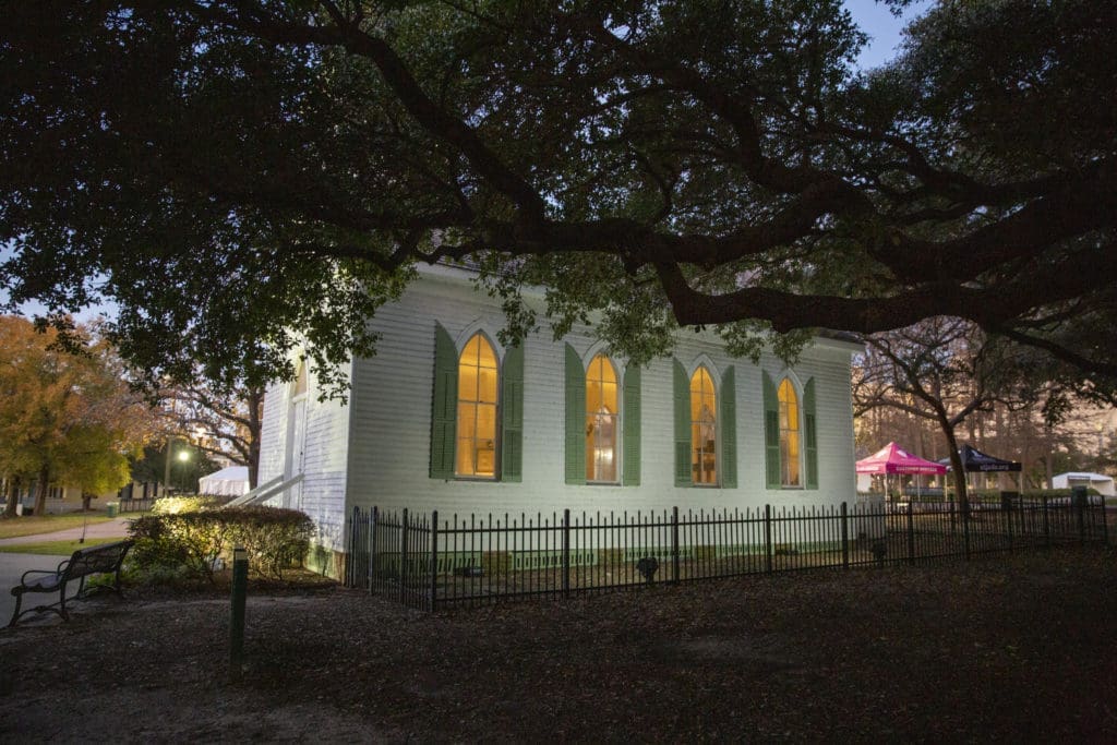 The historic St. John Church, 1891, illuminating the grounds of The Heritage Society at Sam Houston Park with love and light. (Photo by Jenny Antill Clifton)