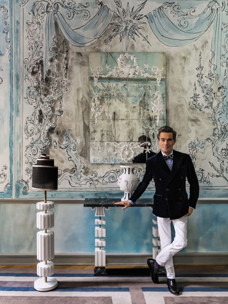 Parisian designer Vincent Darré in front of his XIV Mirror for OKA ($2,995), crafted with resin and beach wood for a surreal effect. 