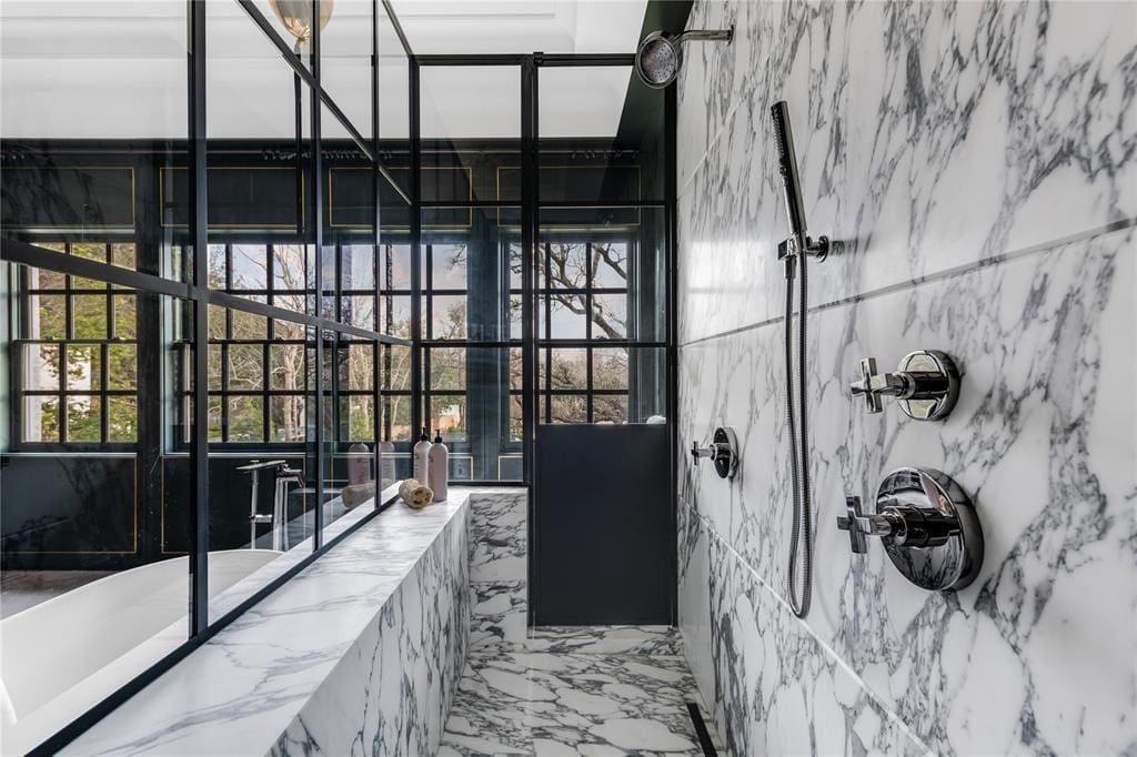 Lighting sourced from Dallas antiques dealer John Gregory Studios can also be found in the primary bath.  (Photo by Costa Christ Media)