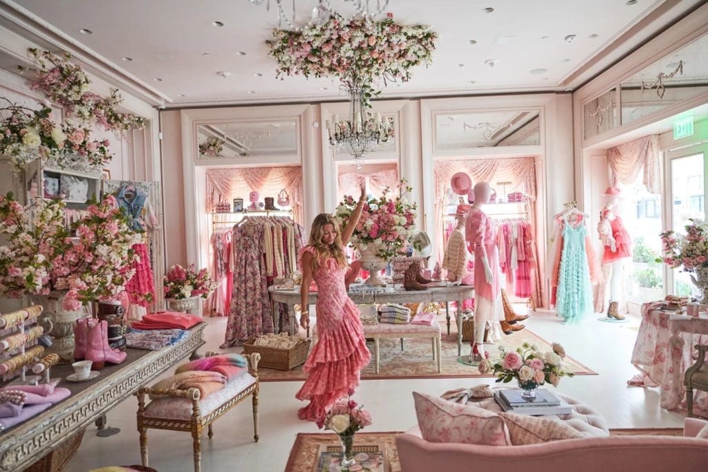 LoveShackFancy founder and creative director Rebecca Hessel Cohen celebrates her new Houston store in a ruffled dress.