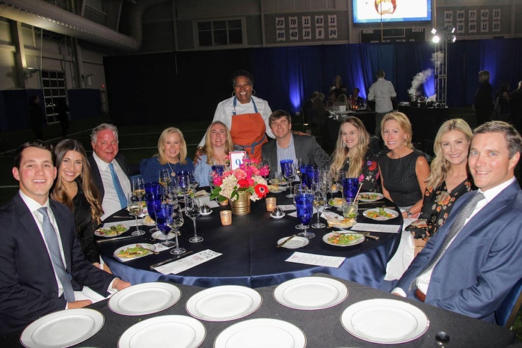 Chef Miriam Jimenez serving sponsors C2 Advisors, Boynton, Brown, Gunawan & Nettle