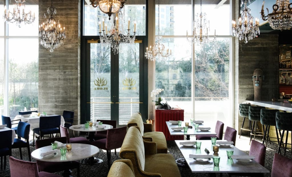 A view of the entrance and intimate seating by the bar of Flora. (Photo by Jack Thompson)