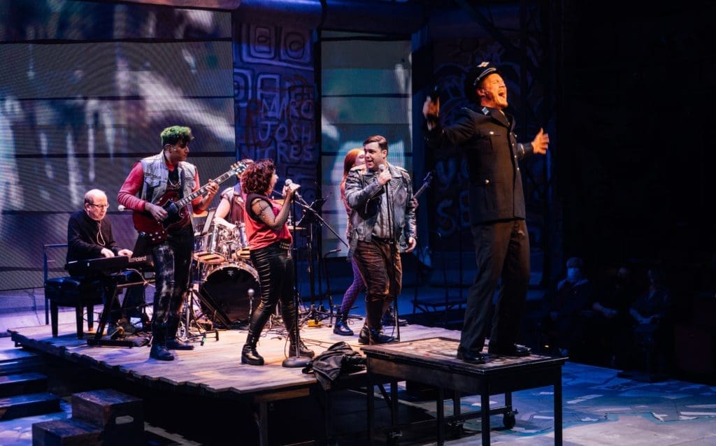 MacGyver's ingenuity and 80s rock help bring the Berlin Wall down in Stages' world premiere MacGyver: The Musical (Photo by Os Galindo)