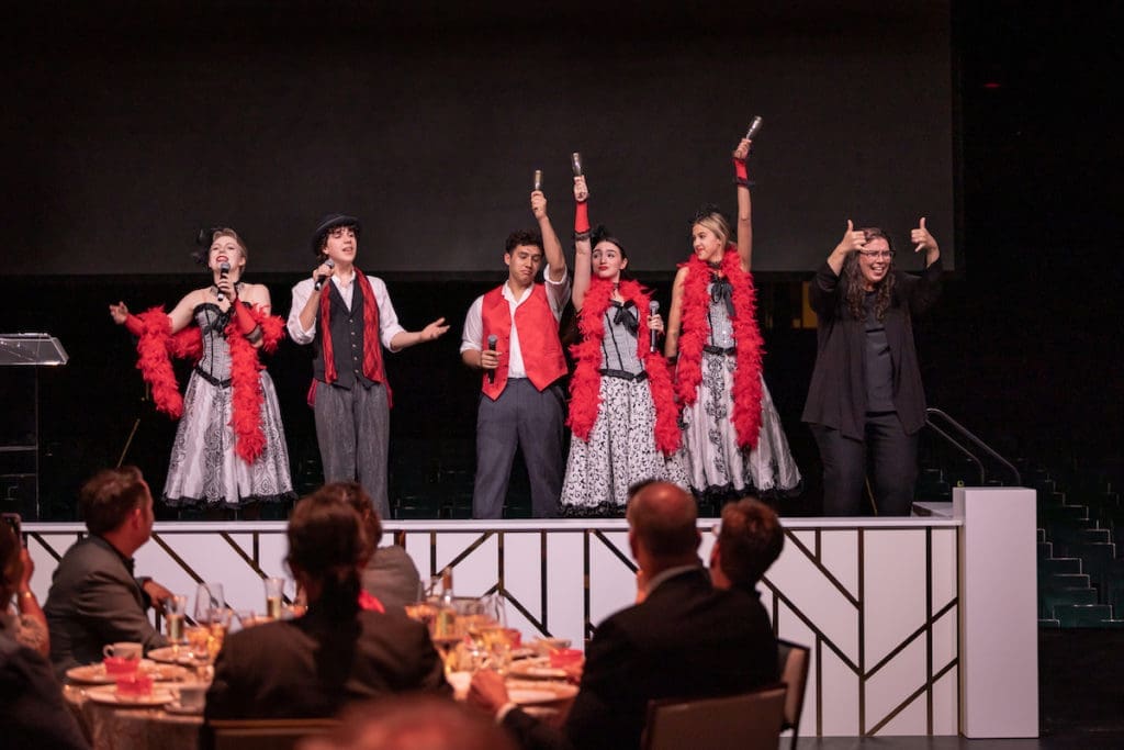 Broadway Dallas High School Musical Theatre Awards program — Maya Michalski, Curtis Wood, Bennett Cooper, Riley Jones, and Jill Wright — with interpreter Andrea Raye perform a song from  Moulin Rouge! (Photo by Thomas Garza Photography)