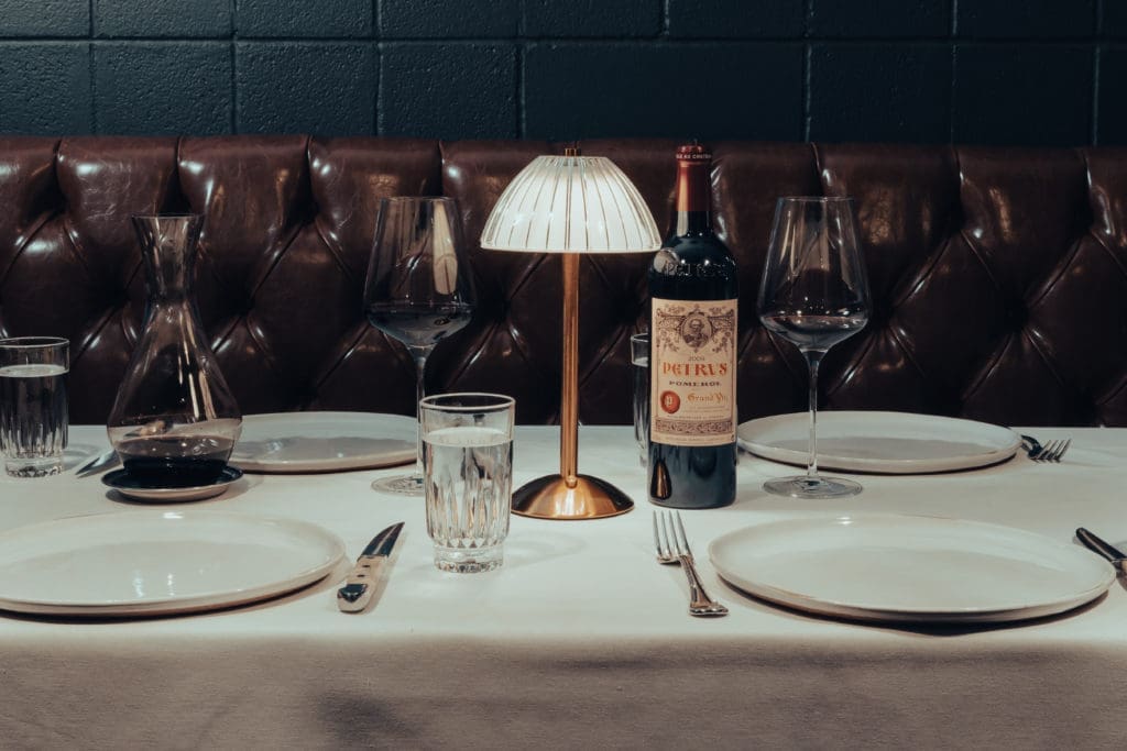 A candlelight table in the new hideaway steakhouse in the Heights, Patton's. Photo by Barrett Doke