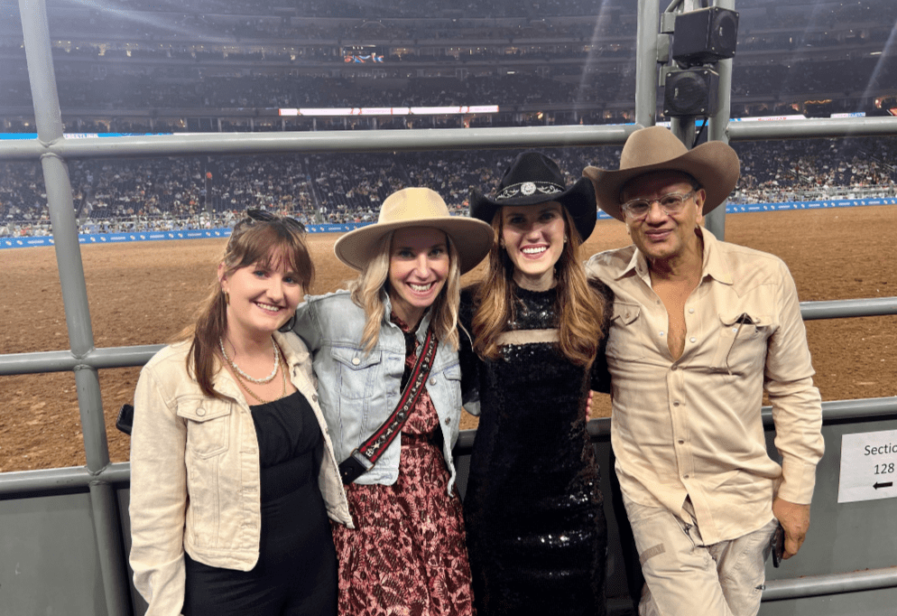 Naeem Khan, right, and his team members Ilena Brady and Kristen Seredynski join Neiman Marcus  brand experience manager Heather Almond, second from right, at the Houston Livestock Show and Rodeo. (Courtesy photo)
