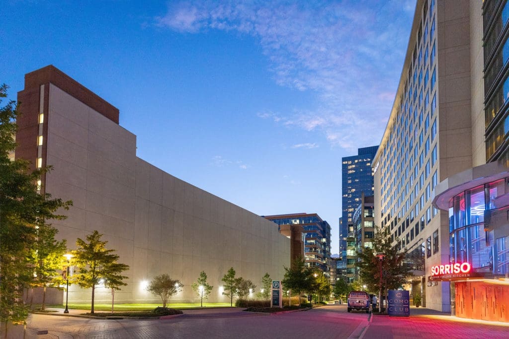 The massive parking garage wall at The Woodlands' Waterway Square will soon be dressed in a 105X385 foot mural, the artist and elements to be revealed as the work progresses. 