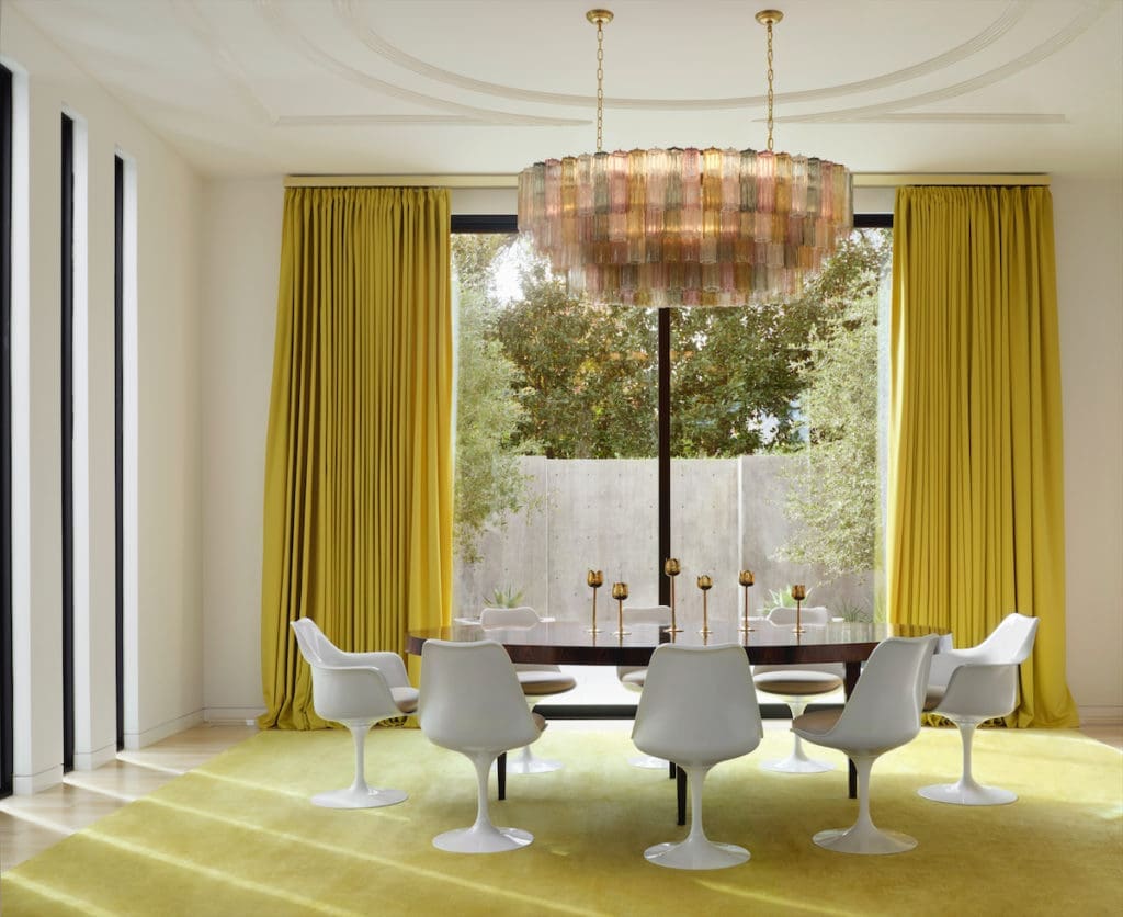 The dining room's Brazilian rosewood table custom made by Keith Fritz through George Cameron Nash. Eero Saarinen chairs from Knoll. Custom rug from The Rug Company. Murano 1970s chandelier from France. Julie Hayes and architect Weldon Turner collaborated on the plaster ceiling design. (Photo by Lisa Petrole)