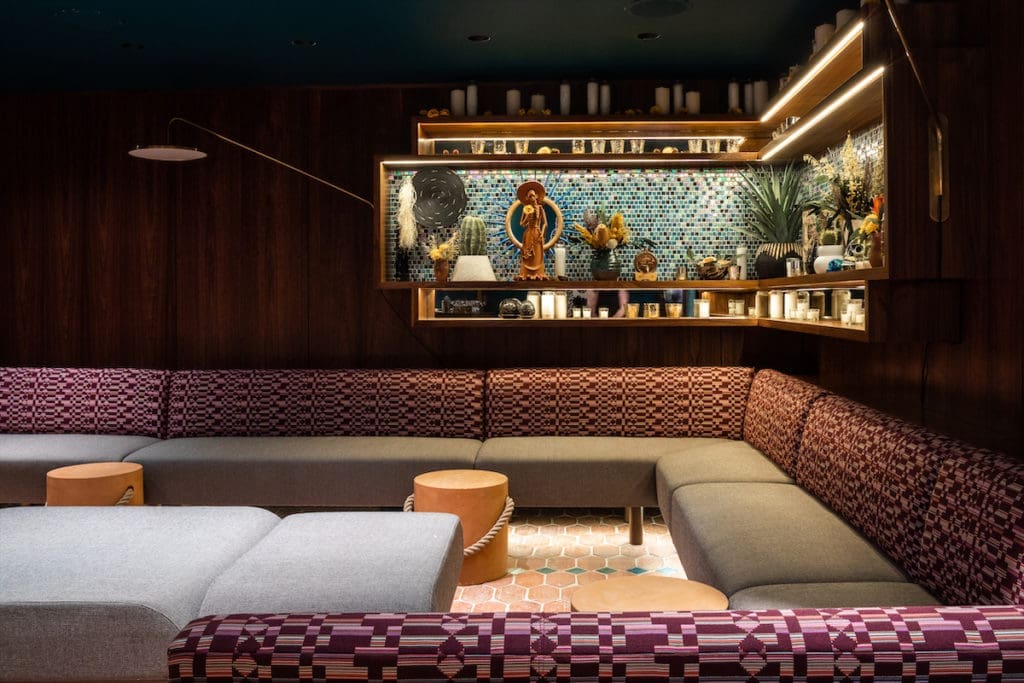 A corner banquette at Apatito, the speakeasy at La Mina.