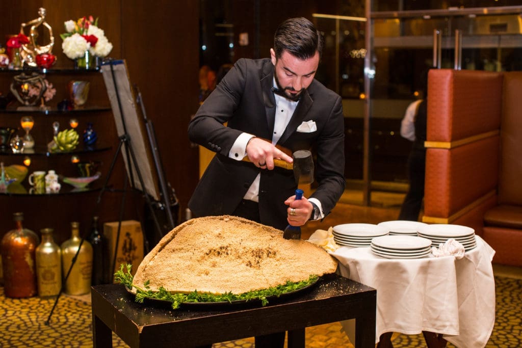 Tony's general manager Farish Rivers cracking open the salt-crusted snapper at the Tony Vallone Day in Houston dinner celebration (Photo by Andrew Hemingway)