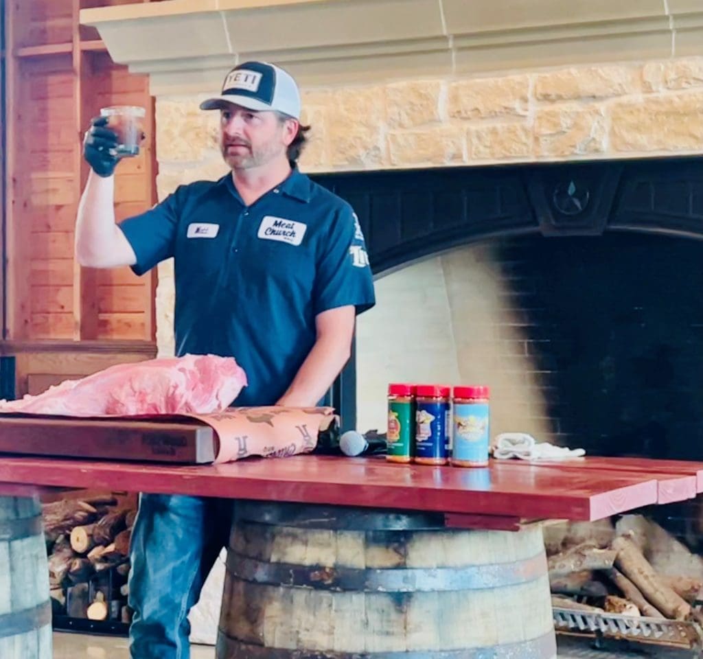 Matt Pitman toasts the class with a TX Whiskey Pecan Old Fashioned at Barbecue School. Photo by Courtney Dabney.
