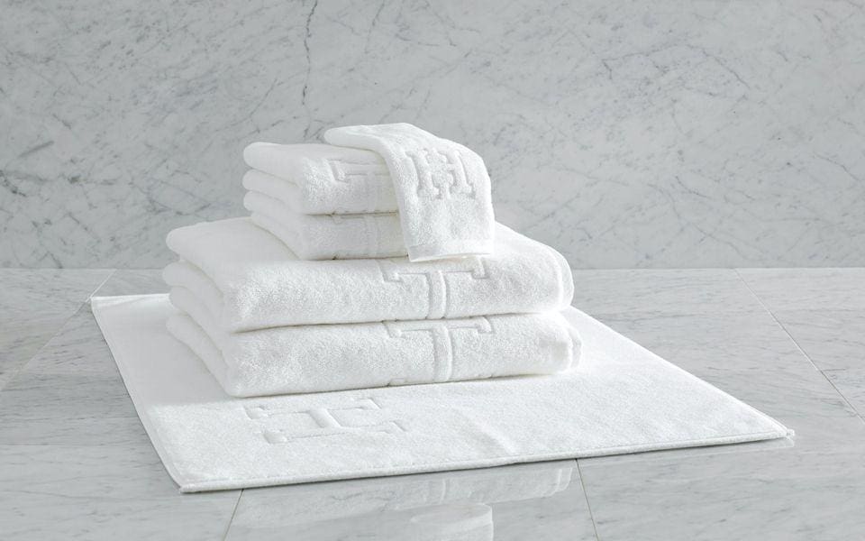 Matouk Auberge monogrammed towels and bath mats.