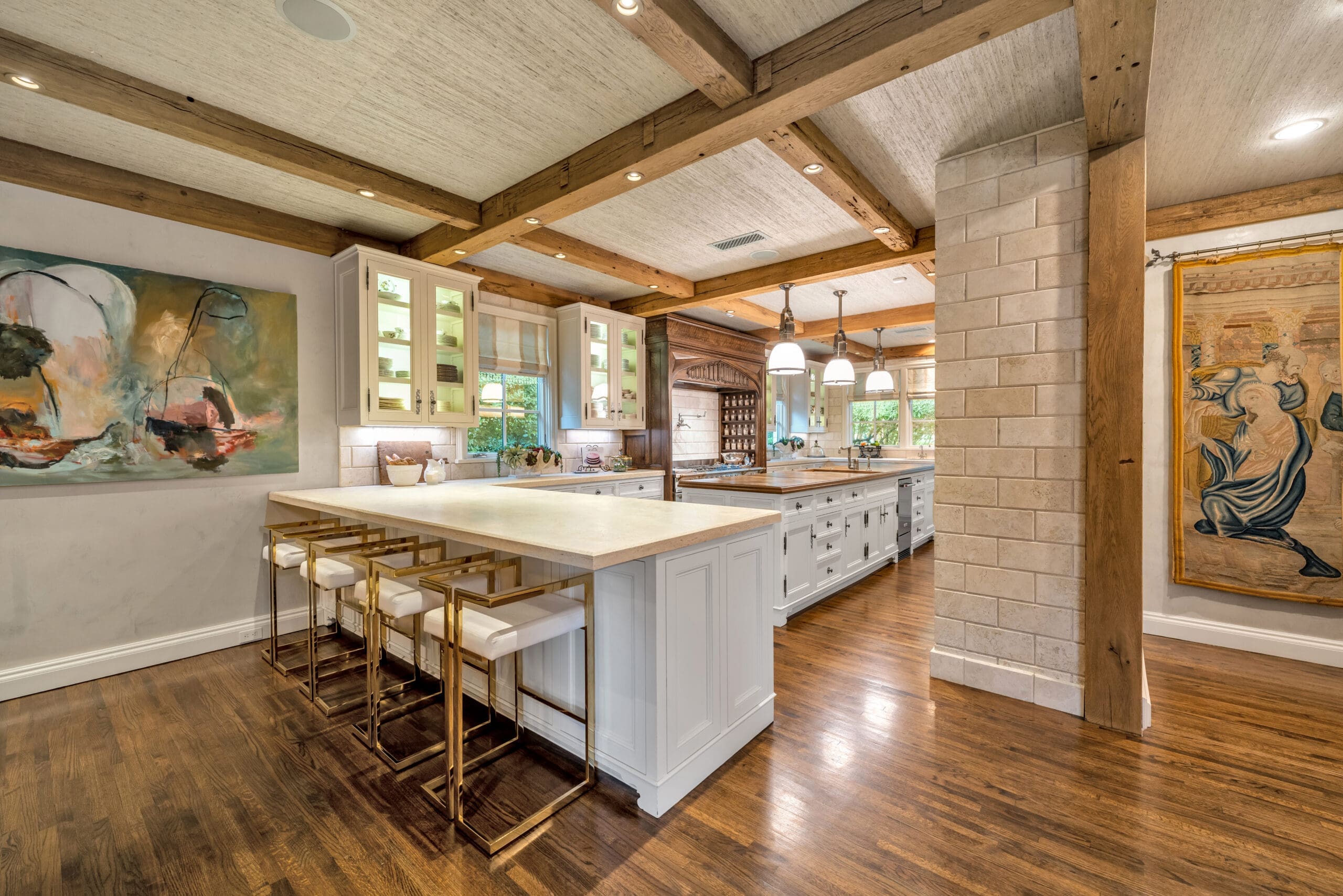 2710 – Old World beams and hood accents mix with modern bar seating overlooking the kitchen.