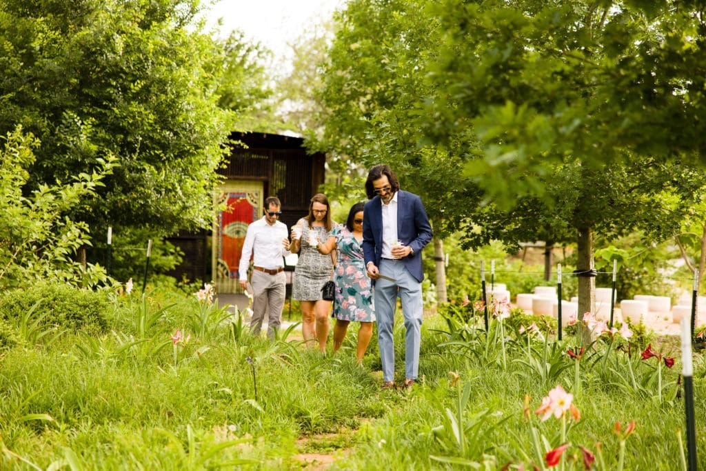 Guests stroll through Houston Botanic Garden during The Secret Garden Party (Hung L. Truong Photography)