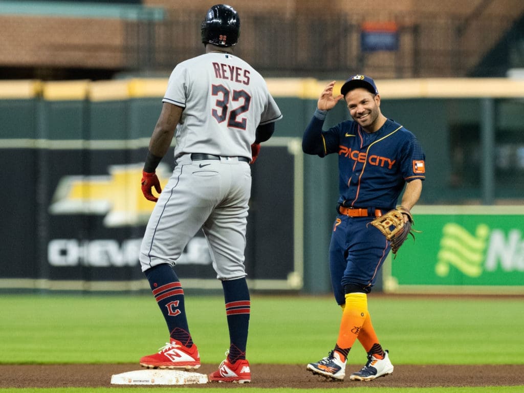 Franmil Reyes and Jose Altuve caught up at second base. (Photo by F. Carter Smith)