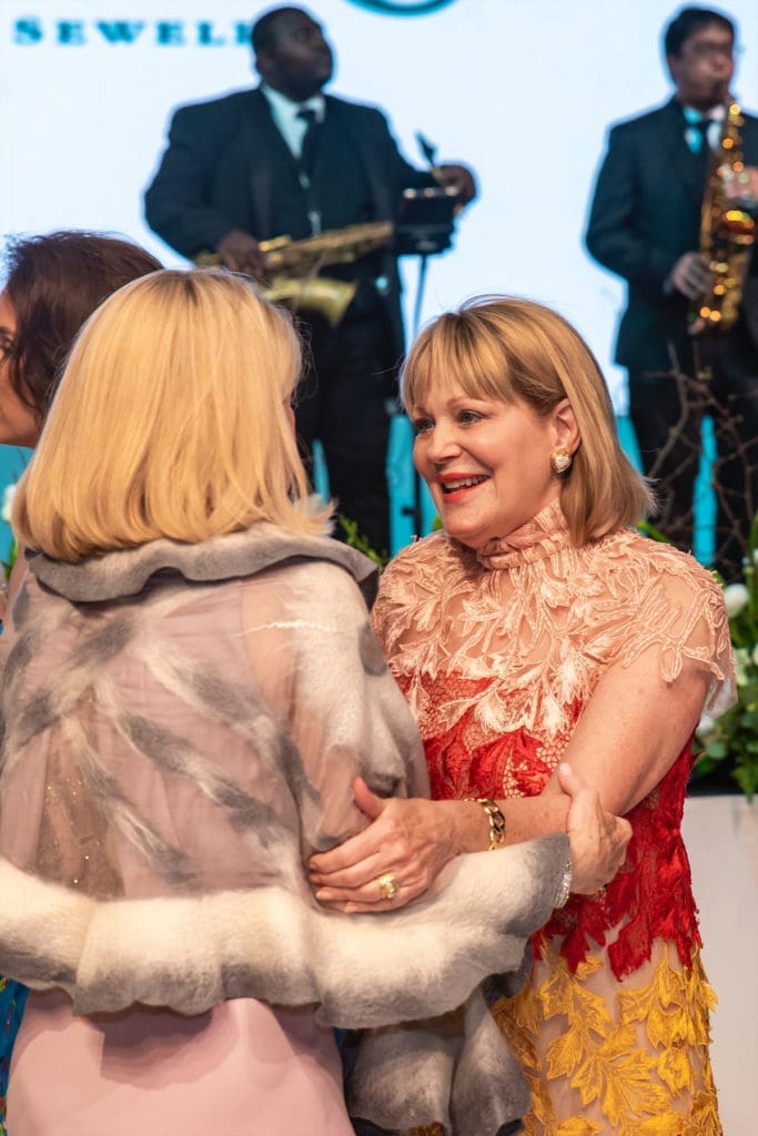 A warm embrace between former Junior League of Dallas ball chairs. (Photo by Tamytha Cameron and Celeste Cass)