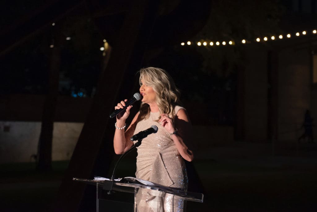 Wendy Lambert led the evening's spirited auction. (Photo by Tamytha Cameron, Nate Rehlander, and Hal Samples)