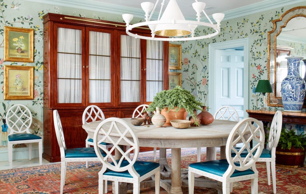 The dining room with de Gournay wallcovering and chairs from Miles Redd’s collection for Ballard Designs. (Photo by Trevor Tondro and Otto )