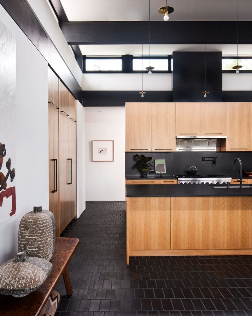 Joshua Rice designed the custom oak cabinetry in the bar and kitchen areas. (Photo by Stephen Karlisch and Robert Tsai)