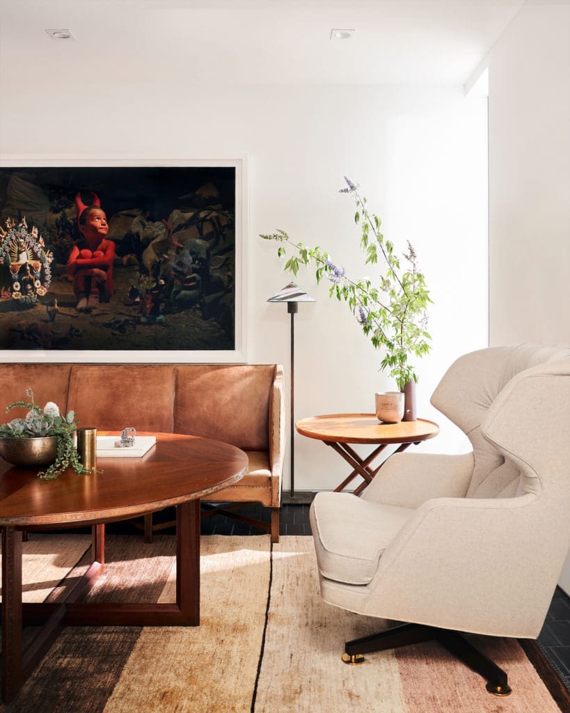 In the library, vintage Frank Lloyd Wright table, vintage Edward Wormley for Dunbar chair, antique Egyptian teak side table by Mogens Lassen, and rare 1930s Danish sofa by Kaare Klint for Rud. Rasmussen Snedkerier, all from Sputnik Modern. Mexico-based artist Jesus Alexandre’s photograph. (Photo by Stephen Karlisch and Robert Tsai)
