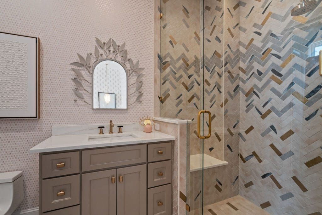Intricate and eye-catching tile design in secondary bath.
