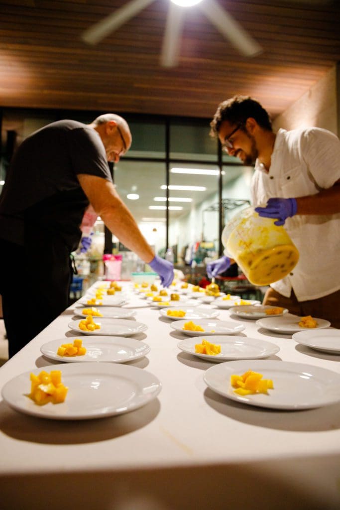 Karuna Kitchen's Antonio Manega and Michael de la Torre of Sun and the Moon Foods at the Summer Soulstice Dinner. (Photo by Liz Silva)
