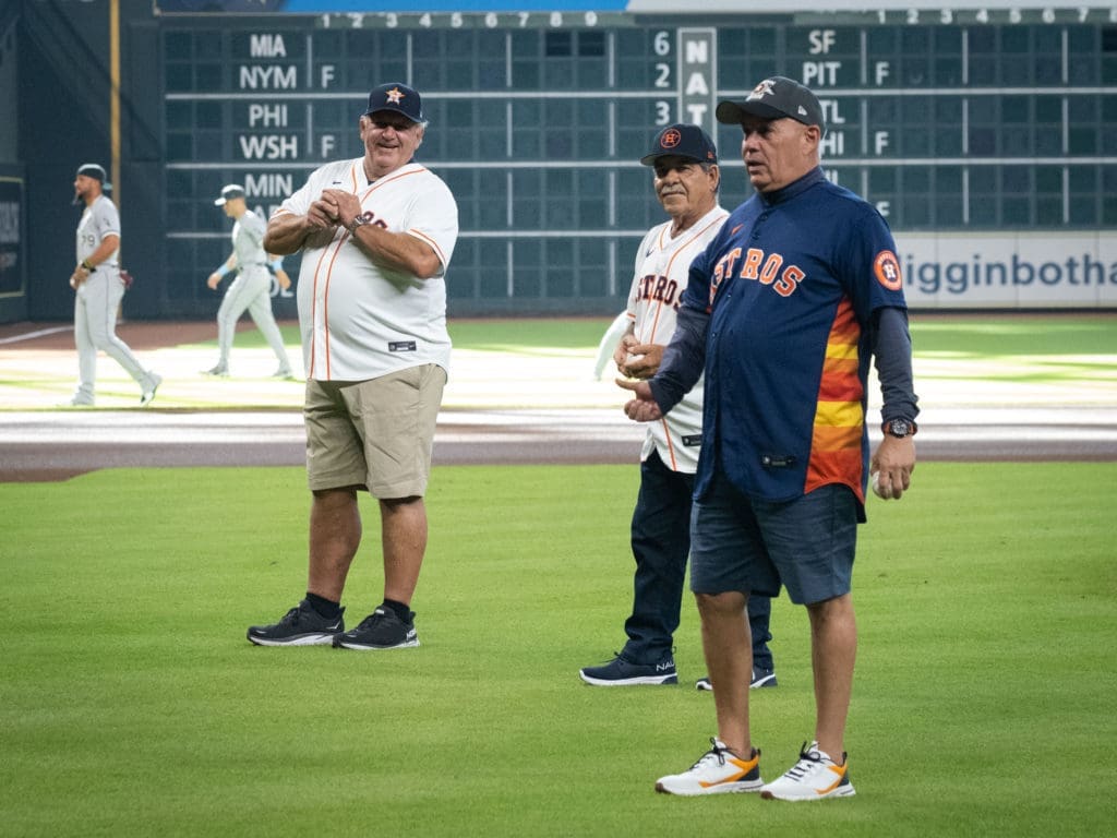 Houston Astros dads Lance McCullers Sr., Raul Enrique Urquidy and Carlos Altuve all threw out first pitches on Father's Day night. (Photo by F. Carter Smith)