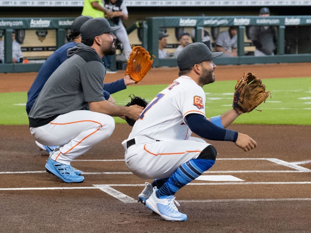 Houston Astros players Lance McCullers Jr., Jose Urquidy and Jose Altuve seemed even more excited than their dads for the Father's Day first pitches. (Photo by F. Carter Smith)