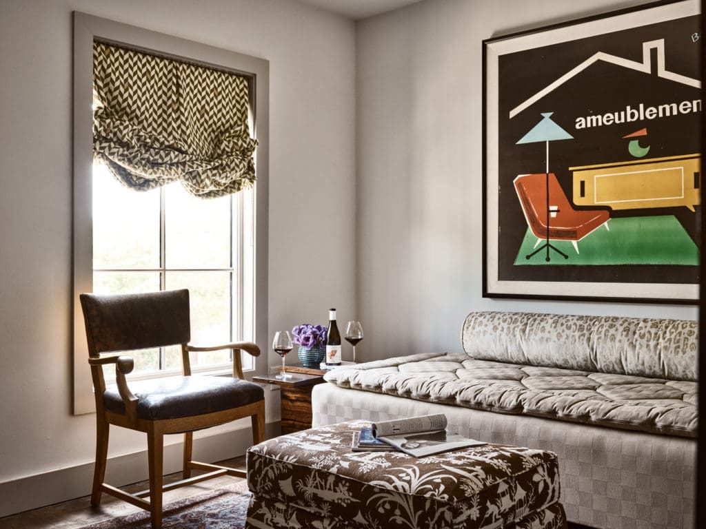 A living area inside the Marcia apartment with lively patterned linen draperies designed by Jeffrey Bilhuber for Le Gracieux. The daybed is by Hästens. (Photo by Stephen Karlisch).