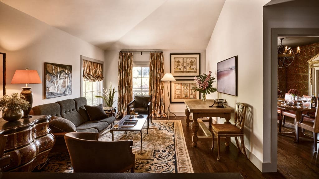 The one-bedroom Marcia apartment's details include Stark Aubusson rugs, original art, and furniture from Dessin Fournir. (Photo by Stephen Karlisch).