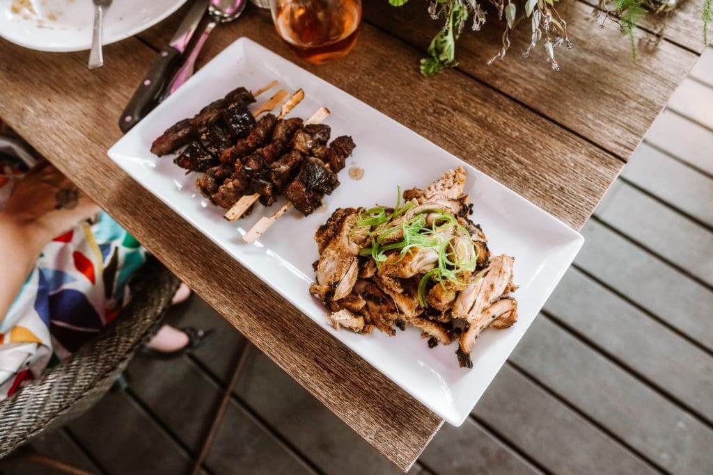 West African-inspired fare from ChòpnBlọk: Roadside steak and Blọk chicken. (Photo by William Issac)