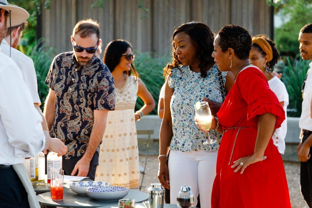 Houston Botanic Garden board members enjoy mocktails in the garden at the Summer Soulstice Dinner. (Photo by Liz Silva)