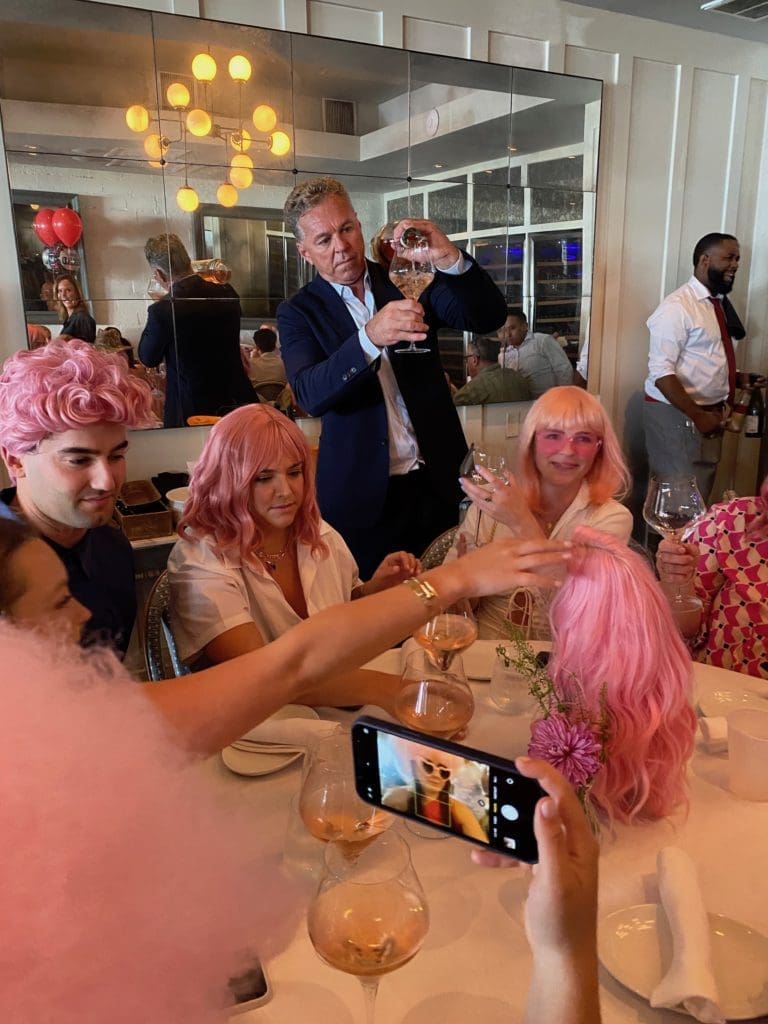 Charles Clark pours rosé at the Brasserie 19 Rosé All Day bash. (Photo by Shelby Hodge)