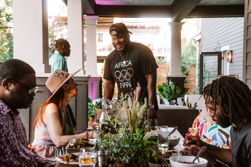 Chef Ope Amosu welcomes Knights Table diners. (Photo by William Issac)
