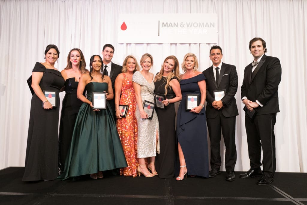 Guests at the 2022 Leukemia & Lymphoma Society Man & Woman of the Year announcement party cheer the record proceeds. (Photo by Daniel Ortiz)