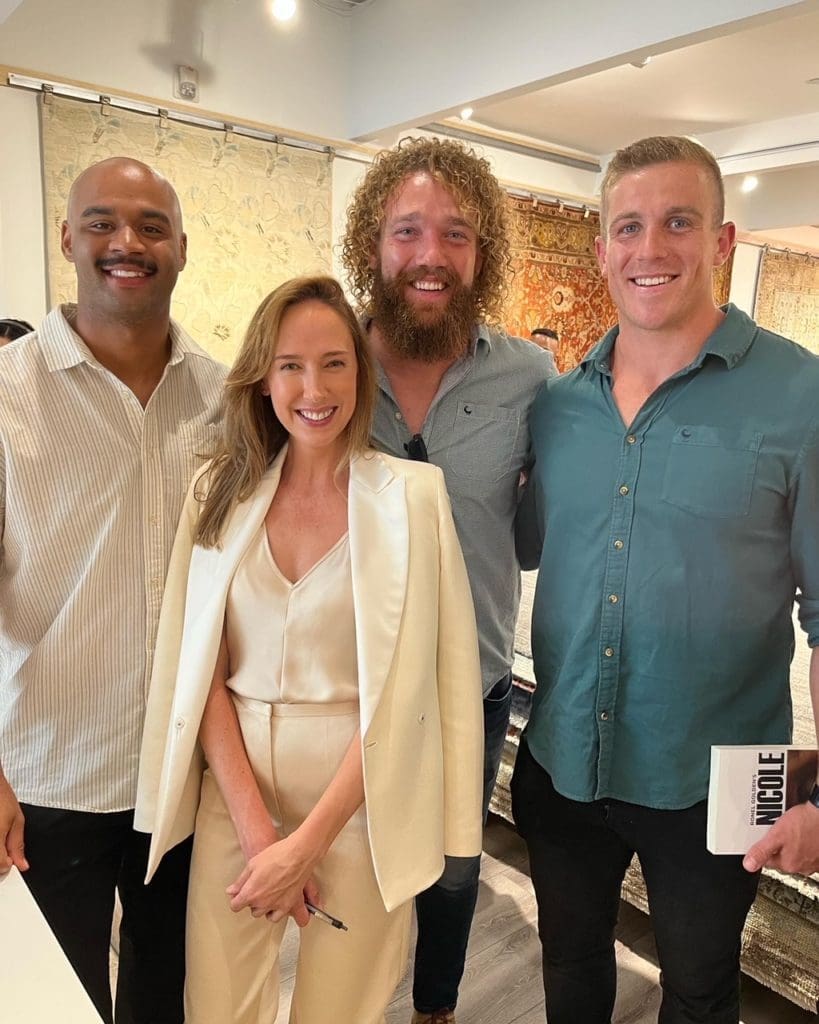 Ronel Golden with South African members of the Houston Sabercats rugby team Malon Al-Jiboori, Willie Britz and Louritz Fan Der Schyff at her book signing at Arsin Rug Gallery in Decorative Center Houston. (Photo by Kathryn Smith)