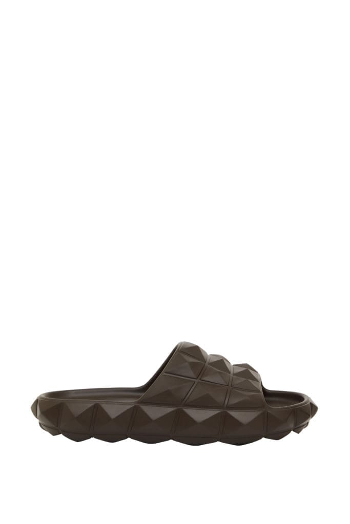 Valentino Roman Stud Turtle Slide Sandal In Rubber, $590, available at Neiman Marcus NorthPark (Courtesy of Valentino)