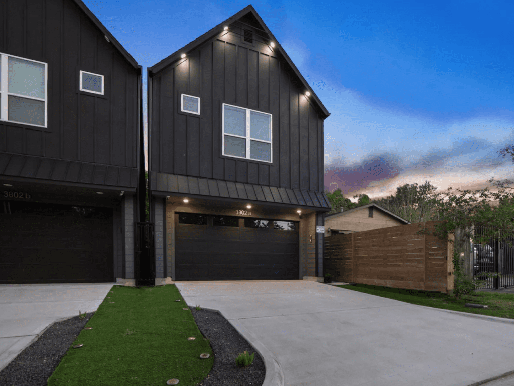 The modest exterior of the Good Vibes HTX Airbnb belies the stylish interiors and lavish garden.