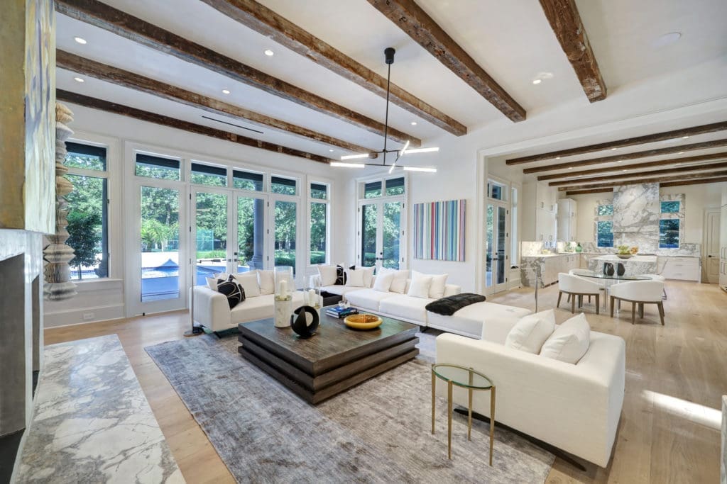 The 100 year old beans add character to the great room and kitchen at 402 Timberwilde Lane.  (Photo by TK Images)