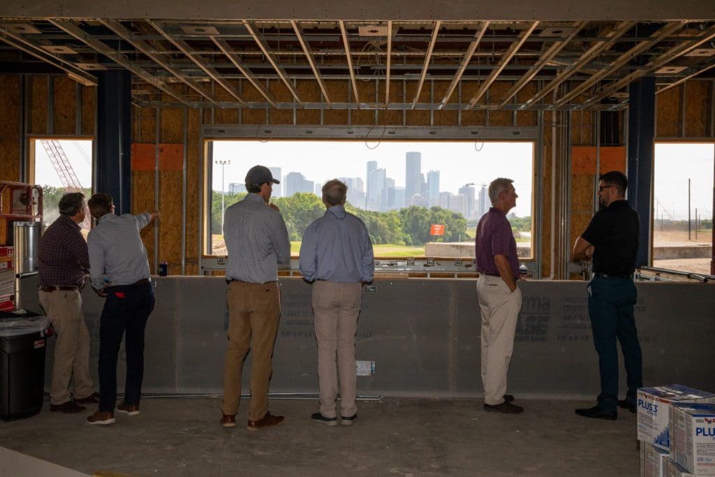 Clayton Freels (left) looks out from the future bar of Riverhouse Houston.