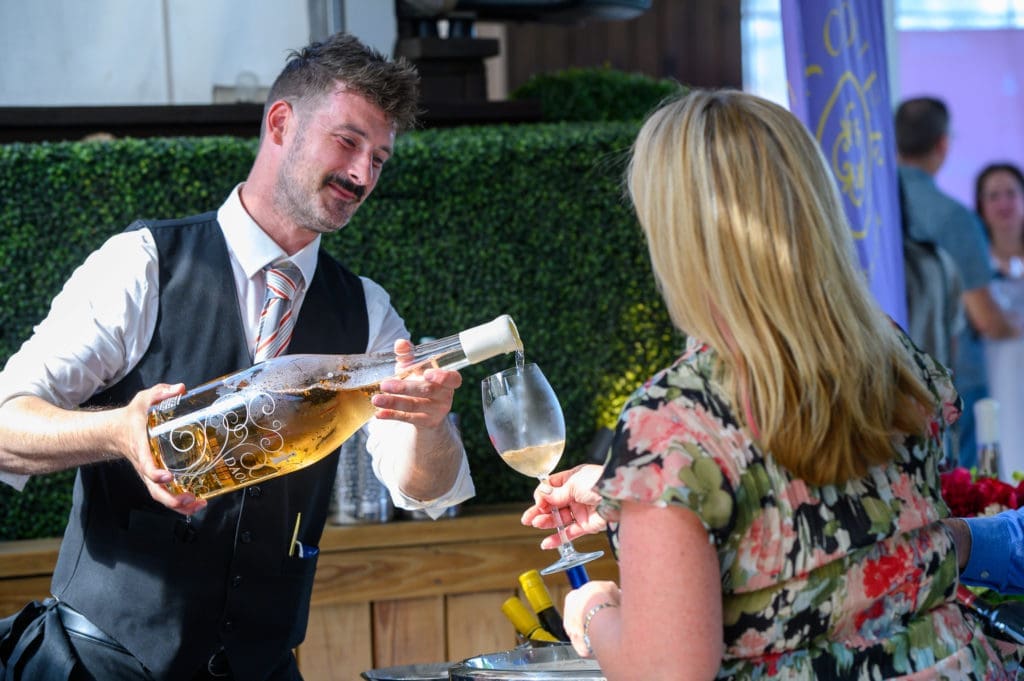 A waiter pours Daou rosé at the special launch of Wine & Food Week, the party held at B&B Butchers & Restaurant. (Photo by Steven David Johnson)