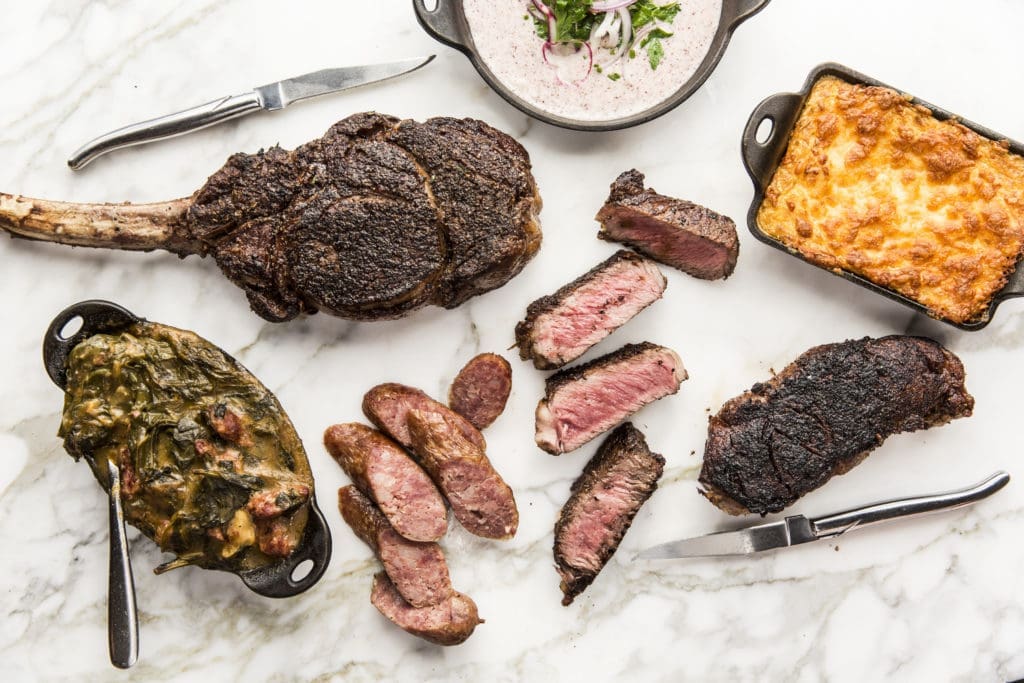 A selection of the dry-aged prime steaks and sides at the new Georgia James location on West Dallas. Photo by Julie Soefer.