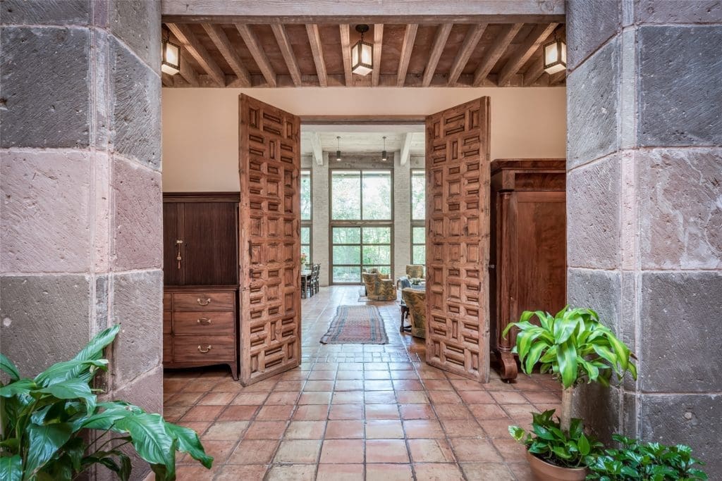 Antique doors in the O'Neil Ford designed home at 3 Longbow Lane were sourced from Mexico. (Photo by Patrick Bertolino for Sotheby's International Realty)