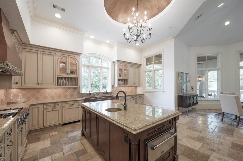 The kitchen boasts top-of-the-line amenities and appliances.
