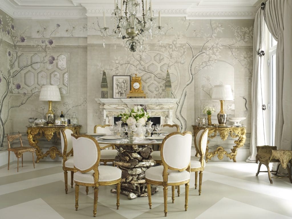 A hand-painted grisaille wallcovering by Gracie wraps the lofty multipurpose space in the 2016 Kips Bay Decorator Show House designed by Alex Papachristidis. (Photo by Tria Giovan)