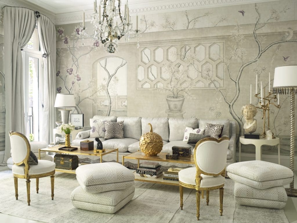 In the multipurpose room of the 2016 Kips Bay Decorator Show House, Frederick P. Victorian & Son made the coffee tables, which have custom tops fashioned by artist Nancy Lorenz; one bears a ceramic gourd by Christopher Spitzmiller. In addition to the 18th-century Italian giltwood chairs with heart-shaped backs from Dalva Brothers are Turkish-style poofs and a fringed sofa made of Cowtan & Tout fabric and Samuel & Sons trim. (Photo by Tria Giovan)