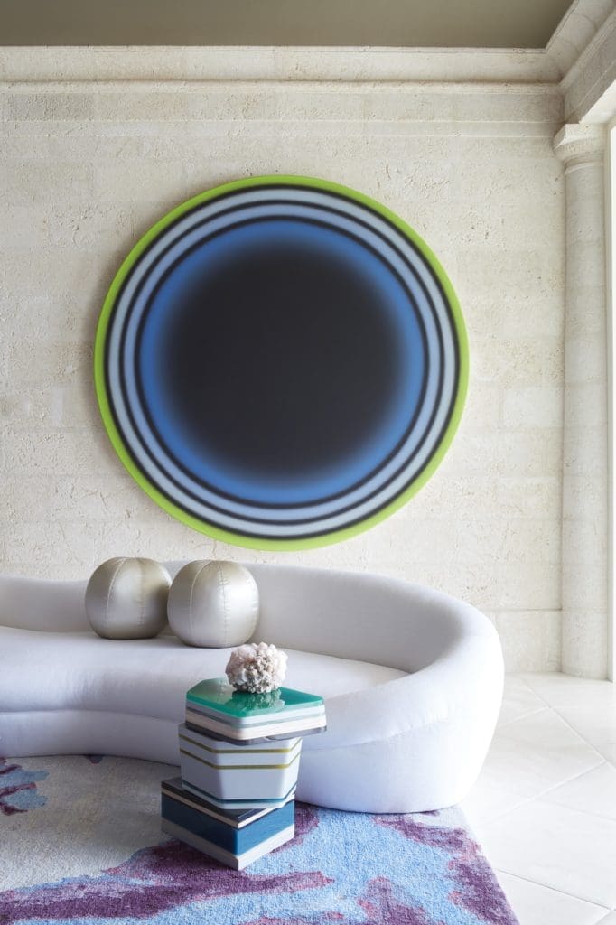 In a Naples, Florida, house, a gemstone side table by Hella Jongerius and a free-form sofa custom-designed by Stephen Sills. (Photo by Simon Upton)
